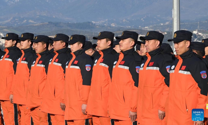Members of the China Search and Rescue Team attend a flag-raising ceremony at their camp in Antakya in the southern province of Hatay, Türkiye, Feb. 10, 2023. China has offered an array of rescue teams and vital items to Türkiye and Syria since massive earthquakes and aftershocks jolted the countries on Monday, in an effort to help search for survivors trapped under the rubble.(Photo: Xinhua)