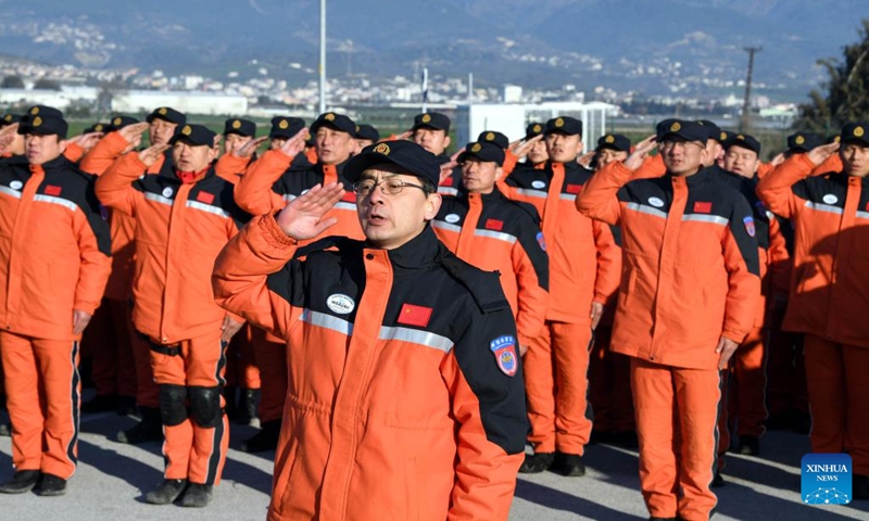Members of the China Search and Rescue Team attend a flag-raising ceremony at their camp in Antakya in the southern province of Hatay, Türkiye, Feb. 10, 2023. China has offered an array of rescue teams and vital items to Türkiye and Syria since massive earthquakes and aftershocks jolted the countries on Monday, in an effort to help search for survivors trapped under the rubble.(Photo: Xinhua)