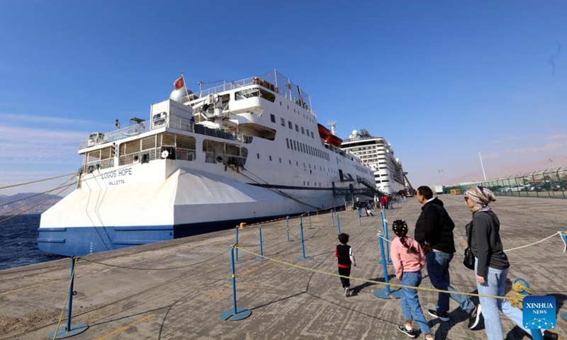 People visit the library ship Logos Hope in the port of Aqaba, Jordan, on Feb. 13, 2023. The library ship Logos Hope presented a floating book fair with some 5,000 books in a wide range of subjects.(Photo: Xinhua)