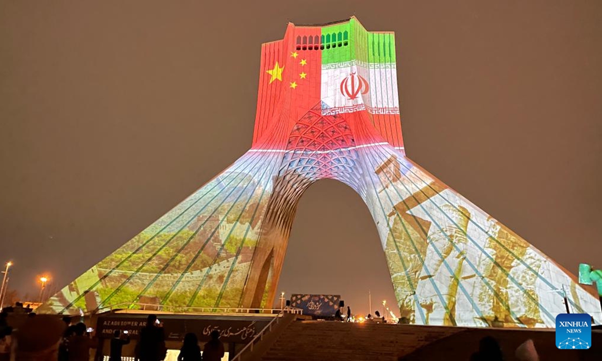 The Azadi Tower is illuminated to mark the Chinese Lunar New Year in Tehran, Iran, on Jan. 31, 2022. The iconic Azadi Tower in Tehran flashed red on Monday, a color associated with good luck and happiness in China, to mark the Chinese Lunar New Year, or Spring Festival, which falls on Feb. 1 this year. (Chinese Embassy in Iran/Handout via Xinhua)