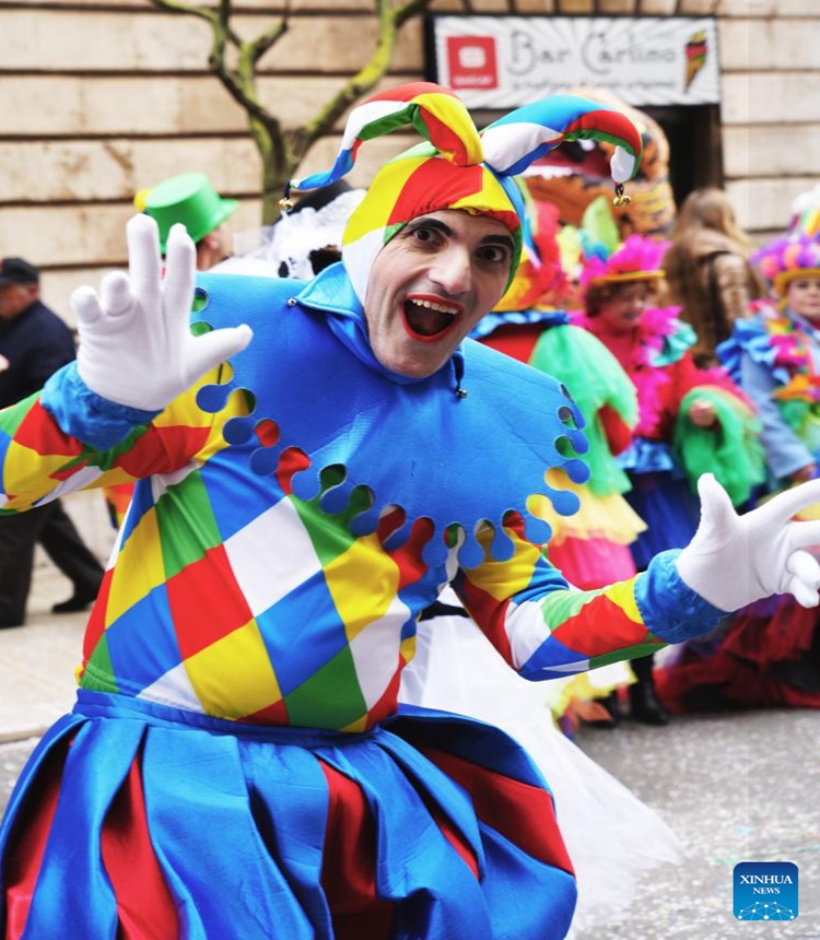 An actor poses for photos during the Carnival of Putignano in southern Italy on Feb. 12, 2023. The Carnival of Putignano is known as one of the oldest carnivals in Italy. (Xinhua/Zhou Xiaotian)