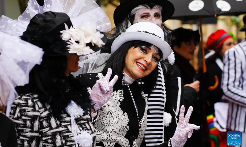 An actor poses for photos during the Carnival of Putignano in southern Italy on Feb. 12, 2023. The Carnival of Putignano is known as one of the oldest carnivals in Italy. (Xinhua/Zhou Xiaotian)