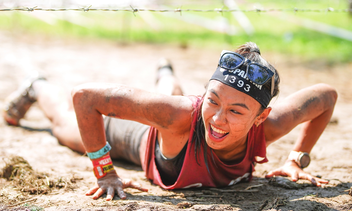 A woman participates in the Spartan race in Beijing on September 10, 2022. Photo: Courtesy of SECA