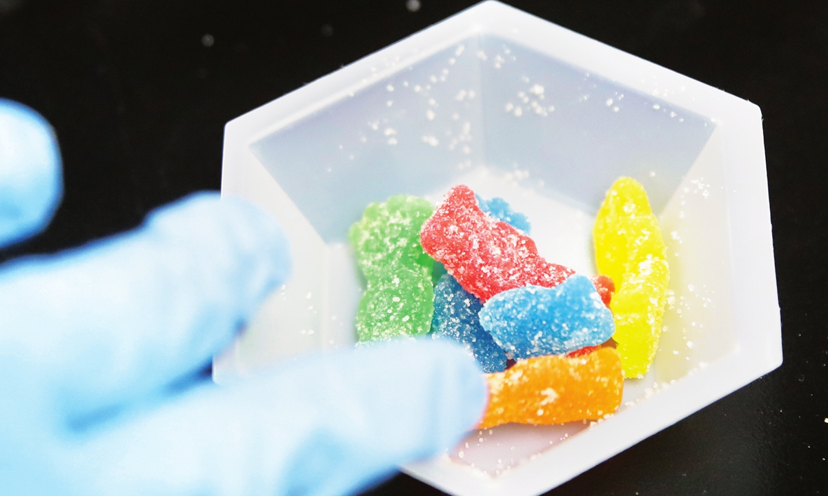 A lab evaluates edible marijuana gummy samples in California on August 22, 2018. Photo: VCG