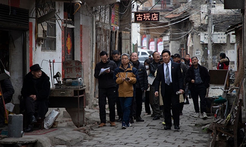 Experts and scholars visit Hengchuan county's cultural site the Yiyang Ancient City street Photo:Courtesy of Art China 