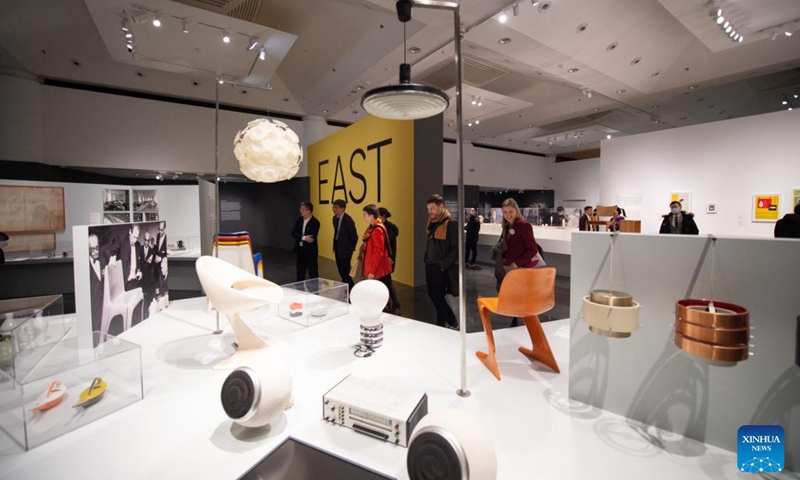 Visitors view the Crossing Parallels: German Design 1945-1990 exhibition in Tsinghua University Art Museum in Beijing, capital of China, Feb. 21, 2023. The exhibition presents over 300 pieces of German design work covering graphic design, furniture design, industrial design, lighting design, interior design, fashion and many other categories.(Photo: Xinhua)