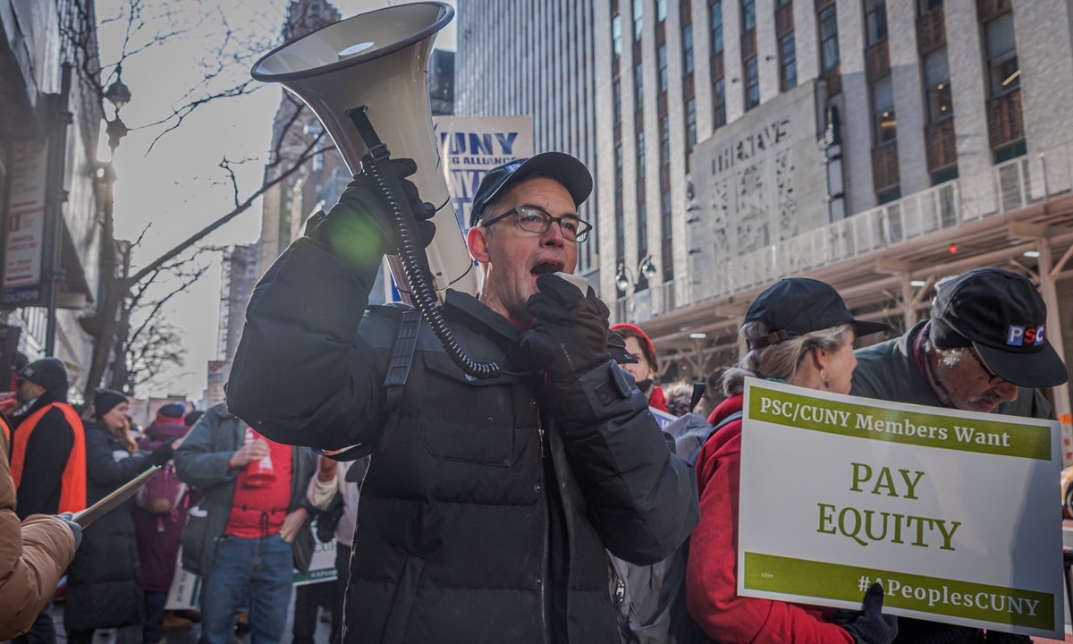 Hundreds of City University of New York staff members rally outside the university on February 27, 2023 calling for a new agreement that includes inflation-beating raises and other advances that help to protect academic quality. Photo: VCG
