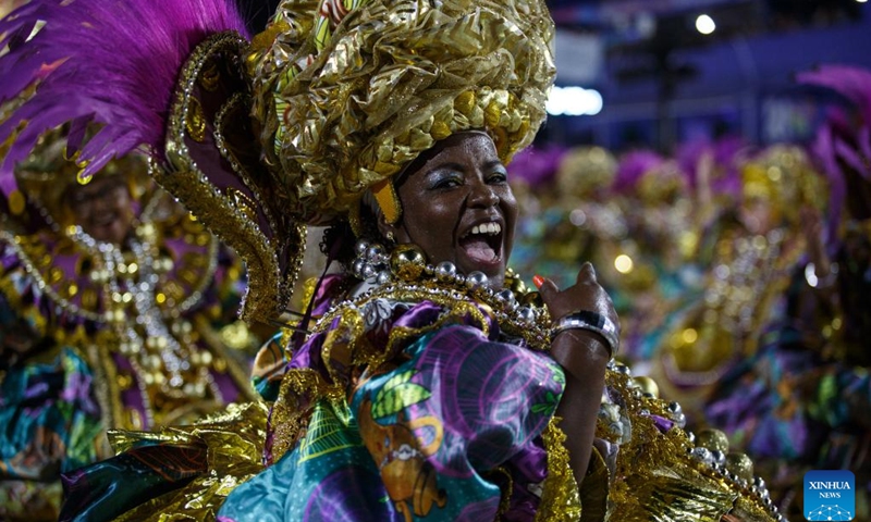 A reveler participates in the carnival parade at the Sambadrome in Rio de Janeiro, Brazil, on Feb. 19, 2023. The Brazilian city's carnival is the South American country's biggest popular festival and one of the largest carnival celebrations in the world.(Photo: Xinhua)
