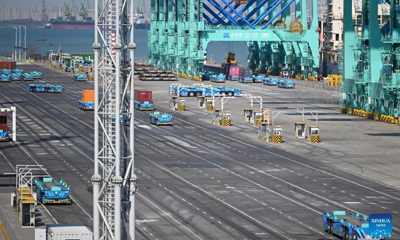 Smart delivery robots work at the full Internet of Things container terminal of Tianjin Port in north China's Tianjin,<strong>888 slot</strong> Feb. 21, 2023. As the maritime gateway to the Beijing-Tianjin-Hebei region, Tianjin Port has been ceaselessly advancing the construction of a smart port, boosting the coordinated development of the region with fresh impetus.(Photo: Xinhua)