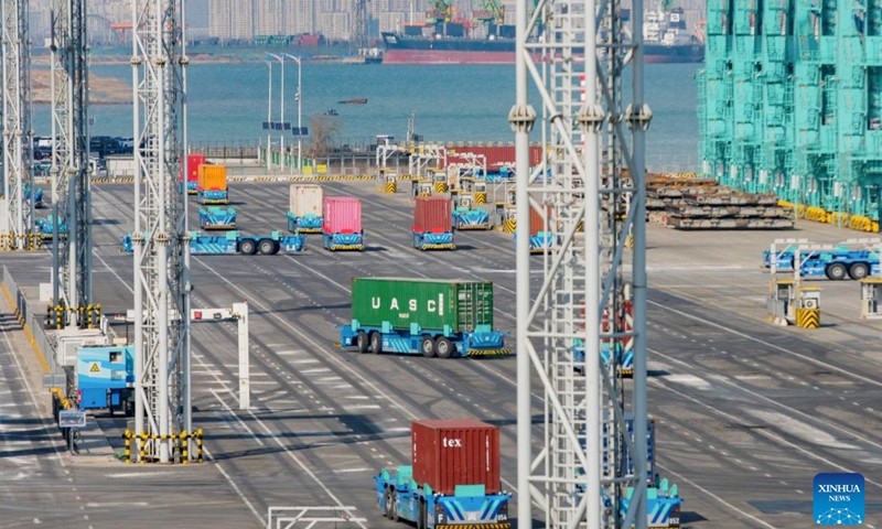 Smart delivery robots work at the full Internet of Things container terminal of Tianjin Port in north China's Tianjin, Feb. 21, 2023. As the maritime gateway to the Beijing-Tianjin-Hebei region, Tianjin Port has been ceaselessly advancing the construction of a smart port, boosting the coordinated development of the region with fresh impetus.(Photo: Xinhua)