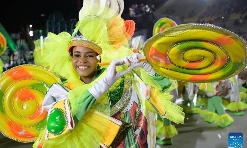 A reveler participates in the carnival parade at the Sambadrome in Rio de Janeiro, Brazil, on Feb. 19, 2023. The Brazilian city's carnival is the South American country's biggest popular festival and one of the largest carnival celebrations in the world.(Photo: Xinhua)