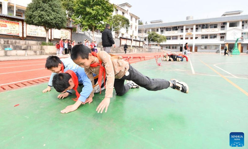 Students take part in a tug-of-war game during a PE class at Xiayi Ethnic School in Mengshan County of Wuzhou City, south China's Guangxi Zhuang Autonomous Region, Feb. 22, 2023.(Photo: Xinhua)