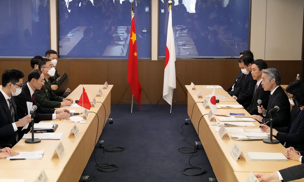 Chinese Vice Foreign Minister Sun Weidong (2nd-left) speaks with his Japanese counterpart Shigeo Yamada (2nd-right) during the China-Japan security dialogue in Tokyo on Wednesday.