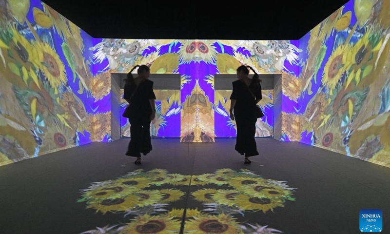 People attend a preview event of Van Gogh: The Immersive Experience at Singapore's Resort World Sentosa, Feb 28, 2023. The exhibition will be open to the public from March 1 to Oct. 1.(Photo: Xinhua)