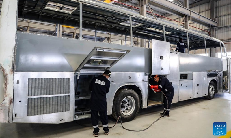 Employees work at a bus assembly plant co-built by Chinese and Saudi firms in Suez Governorate, Egypt, on Feb. 28, 2023. A new bus assembly plant co-built by Chinese and Saudi firms has started production in New Suez City, with the first batch of transport buses expected to roll off the assembly line soon.(Photo: Xinhua)