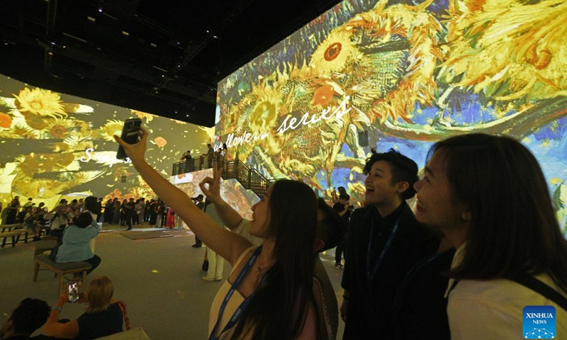 People attend a preview event of Van Gogh: The Immersive Experience at Singapore's Resort World Sentosa, Feb 28, 2023. The exhibition will be open to the public from March 1 to Oct. 1.(Photo: Xinhua)