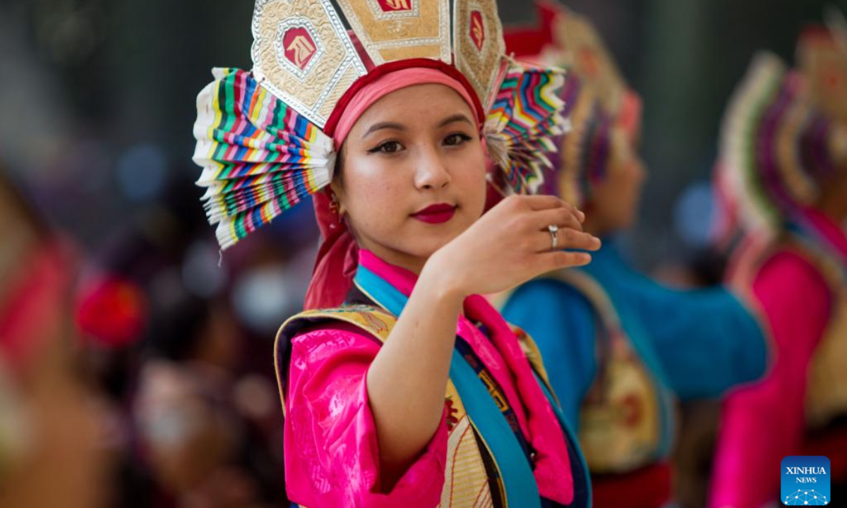 A girl in traditional attire performs during the celebration of Gyalpo Lhosar Festival at Boudha in Kathmandu, Nepal, Feb 23, 2023. Photo:Xinhua