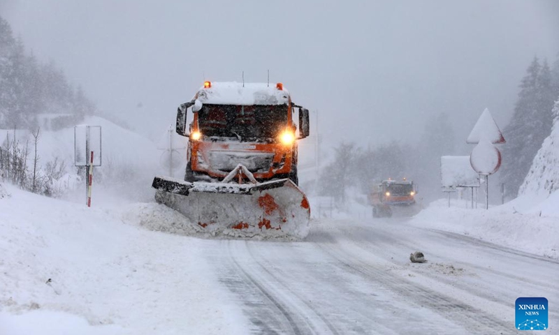 A snow plow clears the road after a heavy snowfall in Delnice, Croatia, Feb. 26, 2023.(Photo: Xinhua)
