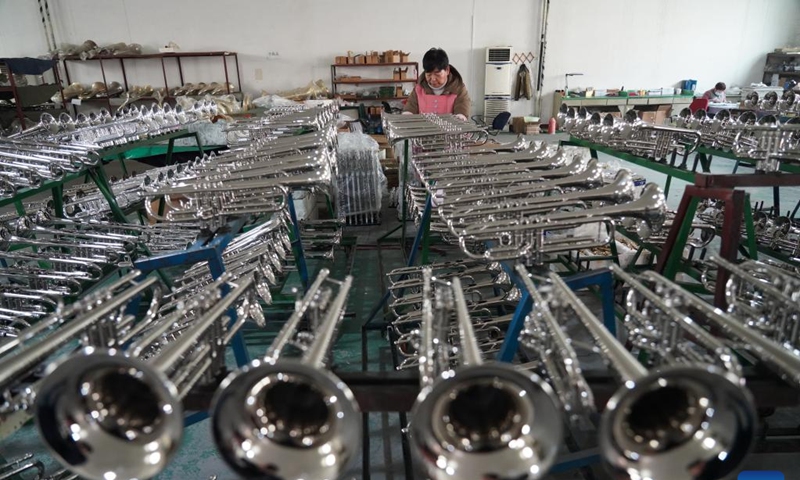 A worker arranges western musical instruments at a manufacturer in Wuqiang County, north China's Hebei Province, on Feb. 23, 2023.

There are 63 musical instrument manufacturers in Wuqiang County, employing more than 10,000 people. More than 400 types of musical instruments are produced in the county and are sold to more than 80 countries and regions. (Xinhua/Mu Yu)