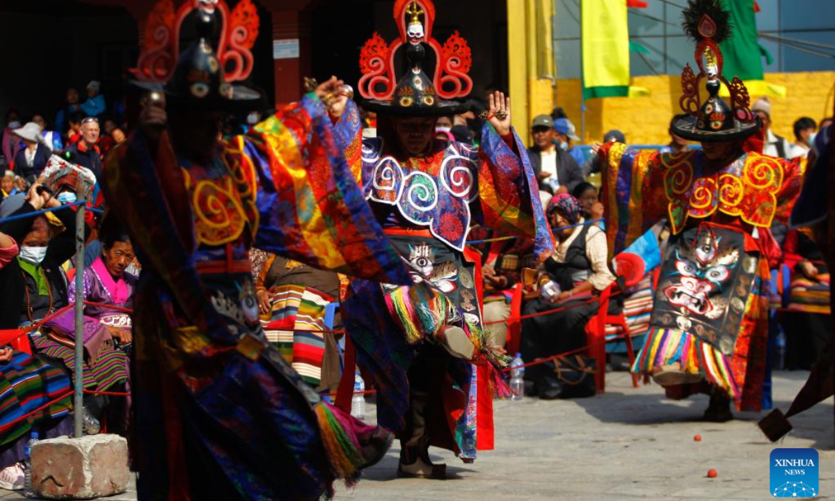 People in traditional attire perform during the celebration of Gyalpo Lhosar Festival at Boudha in Kathmandu, Nepal, Feb 23, 2023. Photo:Xinhua