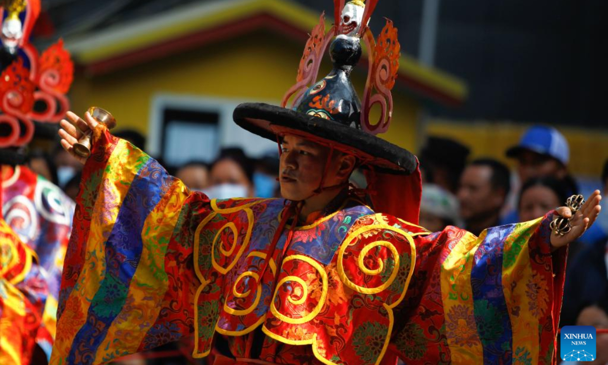 A man in traditional attire performs during the celebration of Gyalpo Lhosar Festival at Boudha in Kathmandu, Nepal, Feb 23, 2023. Photo:Xinhua