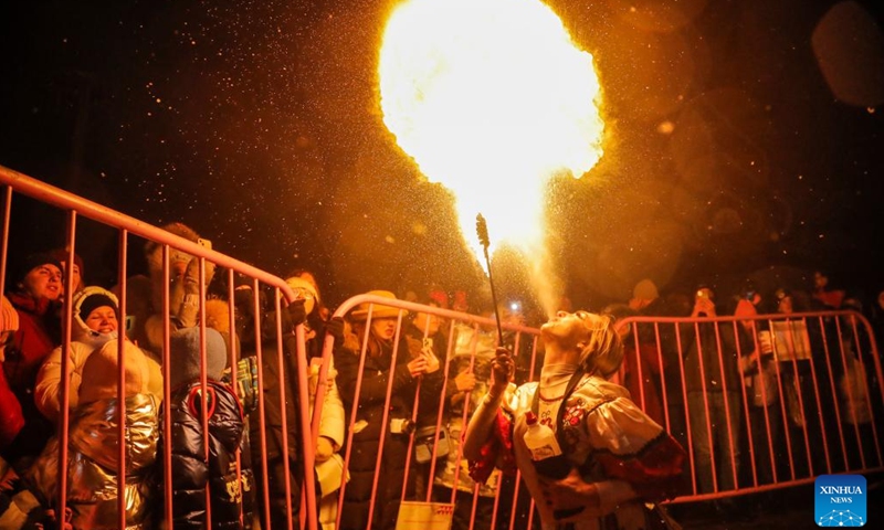 An actor performs with fire during Maslenitsa celebrations in Moscow, Russia, Feb. 26, 2023. Maslenitsa is a traditional holiday to celebrate the beginning of spring.(Photo: Xinhua)