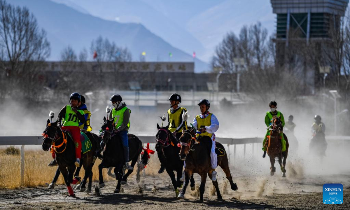 Riders compete in a horse racing during an equestrian show in Lhasa, southwest China's Tibet Autonomous Region, Feb 23, 2023. An annual equestrian show was held here on Thursday to celebrate the Tibetan New Year. Photo:Xinhua