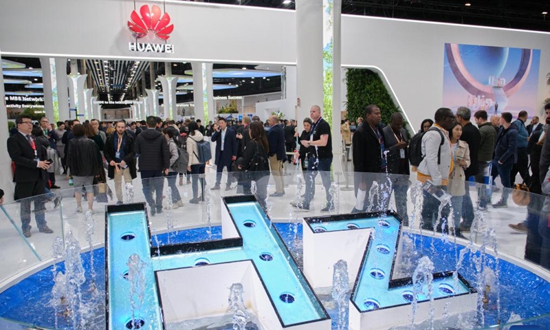 People visit the exhibition area of Huawei at the 2023 edition of the Mobile World Congress (MWC) in Barcelona, Spain, on Feb. 27, 2023. The 2023 edition of the Mobile World Congress (MWC) kicking off Monday in Barcelona saw a strong return of Asian participants, according to the organiser of the city's largest annual event.(Photo: Xinhua)