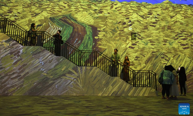 People attend a preview event of Van Gogh: The Immersive Experience at Singapore's Resort World Sentosa, Feb 28, 2023. The exhibition will be open to the public from March 1 to Oct. 1.(Photo: Xinhua)