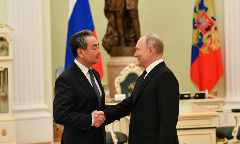 Russian President Vladimir Putin meets with Wang Yi, a member of the Political Bureau of the Communist Party of China (CPC) Central Committee and director of the Office of the Foreign Affairs Commission of the CPC Central Committee, in Moscow, Russia, Feb. 22, 2023.(Photo: Xinhua)