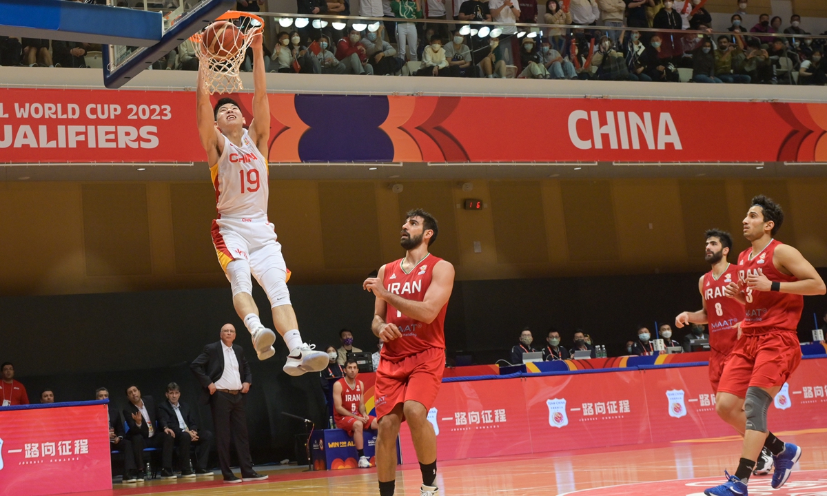Chinese basketball player Cui Yongxi dunks against Iran in their 2023 FIBA World Cup Asian qualifying match in Hong Kong, China on February 26, 2023. China won 86-74. Team China had already secured a berth at the World Cup prior to the match. Photo: VCG