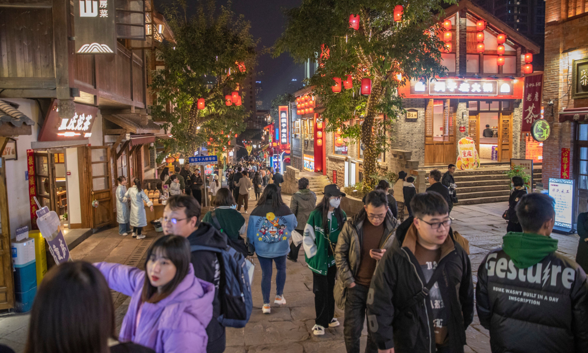 Tourists visit a traditional scenic area in Yuzhong District in southwest China's Chongqing Municipality, Feb. 10, 2023. Chongqing has launched a variety of activities at nighttime to boost night economy since the beginning of this year. (Photo: Xinhua)