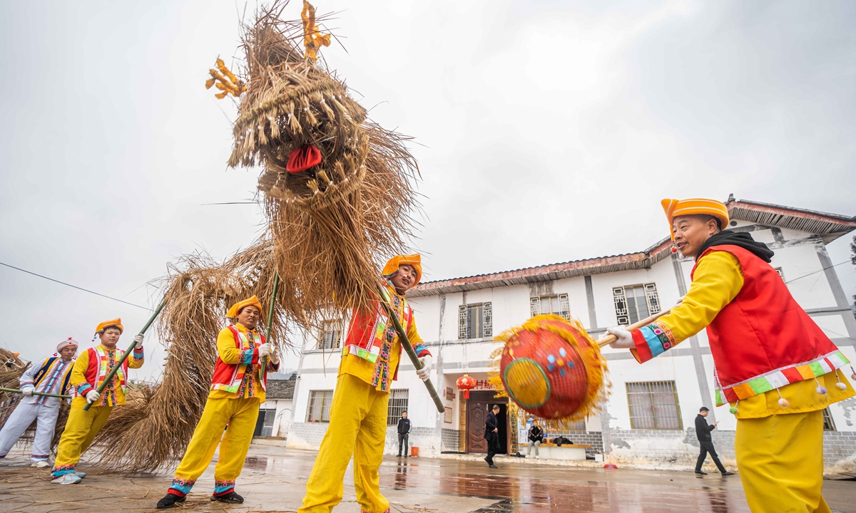 Villagers perform the straw-dragon dance on March 2, 2023 in a village in Bijie, Southwest China's Guizhou Province. With a history of more than 100 years, the straw-dragon dance is staged to pray for good weather and good harvests. Photo: IC