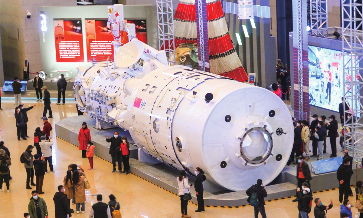 People visit a full-size model of the Tianhe core module of China's space station at the exhibition at the National
Museum of China in Beijing, March 1, 2023. The exhibition, marking the 30th anniversary of China's manned
spacefl ight project, has been held at the museum recently. Photo: IC
