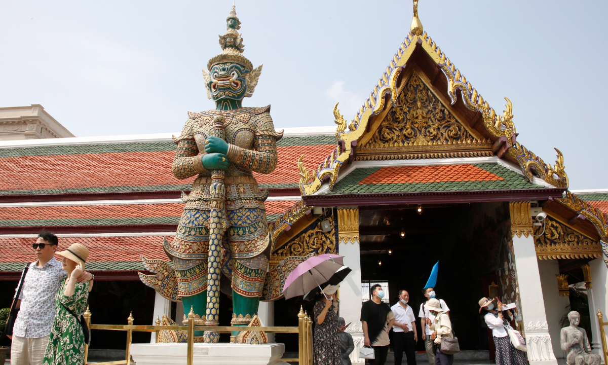 Chinese tourists visit the Temple of the Emerald Buddha, in Bangkok, Thailand, on February 7, 2023. Photo: IC