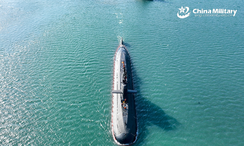A submarine attached to a naval submarine flotilla under the PLA Northern Theater Command bears off a port after separating from the towboats during a day-and-night training exercise in late February, 2023.(eng.chinamil.com.cn/Photo by Shi Jialong)