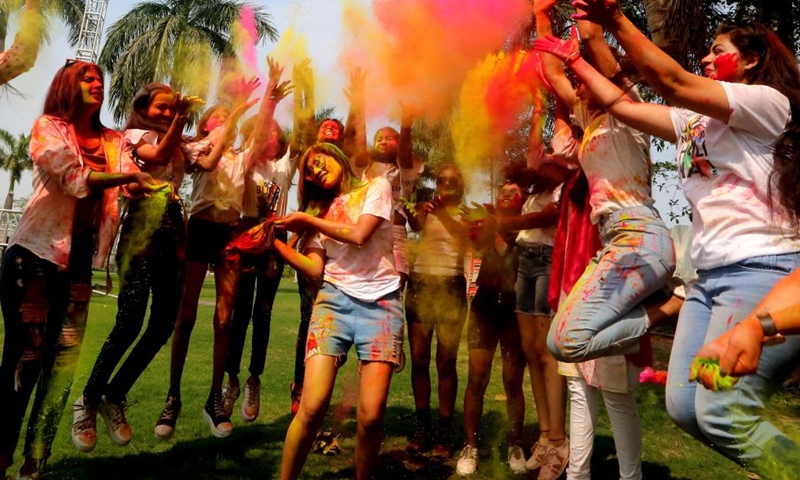 Women smeared in colored powder celebrate Holi festival in Bhopal, capital of India's Madhya Pradesh state, March 6, 2023. Holi, the festival of colors, marks the beginning of the spring season.(Photo: Xinhua)