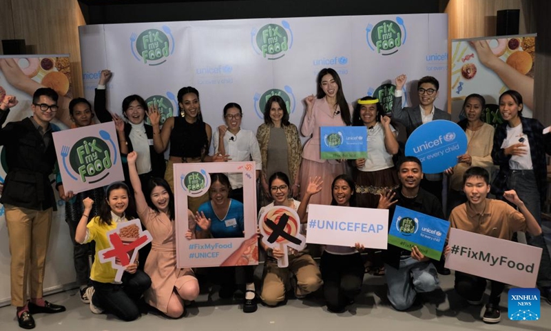 Participants of the UNICEF-supported Fix My Food campaign pose for a group photo in Bangkok, Thailand, Feb. 27, 2023. Youth and celebrities from eight countries, including China, took part in a UNICEF-supported campaign in Bangkok this week, to promote the need for healthier food environments in the Asia-Pacific.(Photo: Xinhua)