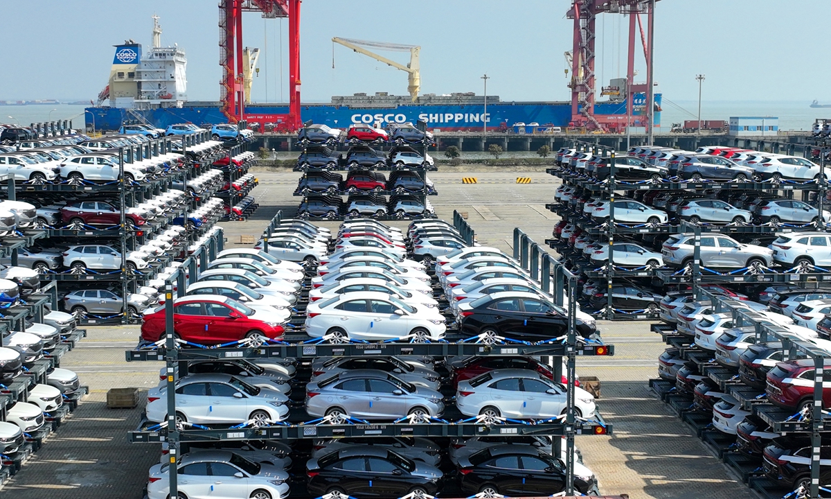 More 2,500 cars made in China are loaded through foldable frames onto a freighter in Taicang port, East China's Jiangsu Province, on March 2, 2023. The automobiles will be shipped to Greece, Spain, Italy and other European countries. Photo: VCG
