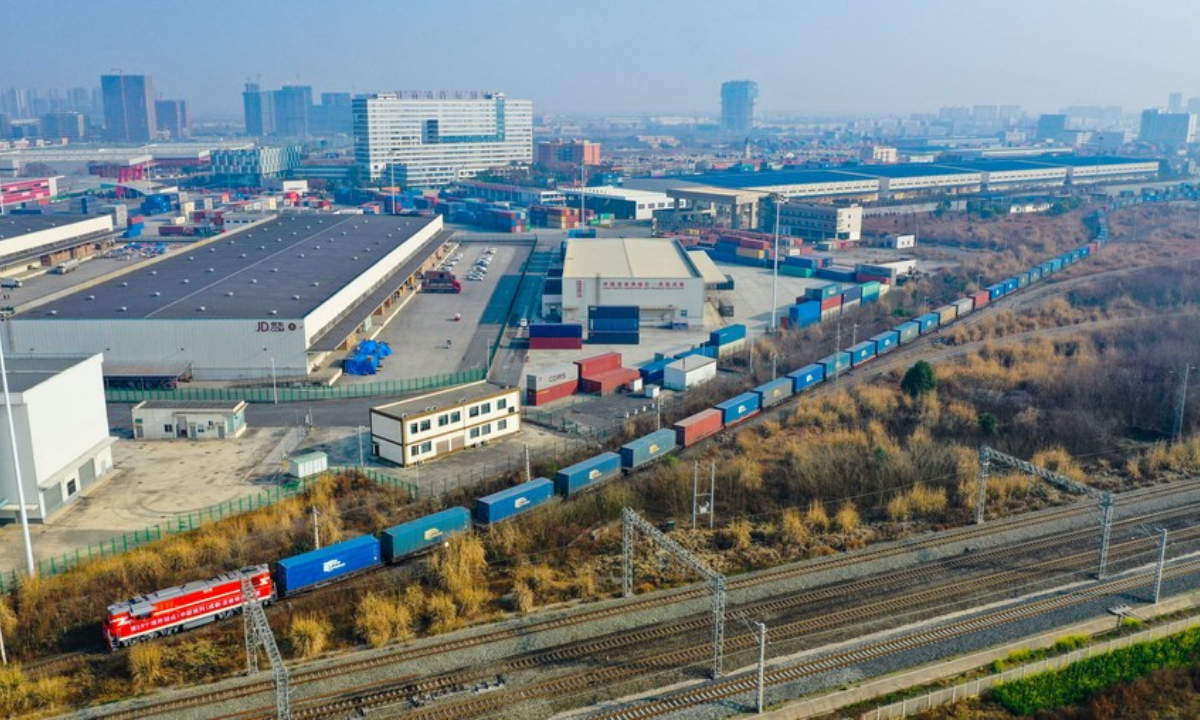 Aerial photo taken on Feb 21, 2021 shows the first China-Europe freight train linking St. Petersburg of Russia with Chengdu departing the Chengdu International Railway Port in Chengdu, southwest China's Sichuan Province. Photo:Xinhua
