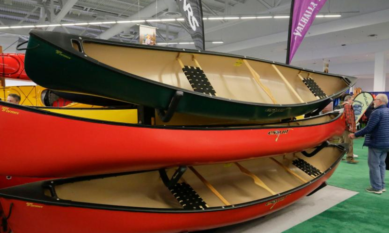 Canoes are displayed at the 2023 Outdoor Adventure and Travel Show at Vancouver Convention Center in Vancouver, British Columbia, Canada, on March 4, 2023. The two-day event, which runs on March 4th and 5th, features the latest outdoor gear and information of adventure travel ideas. (Photo by Liang Sen/Xinhua)