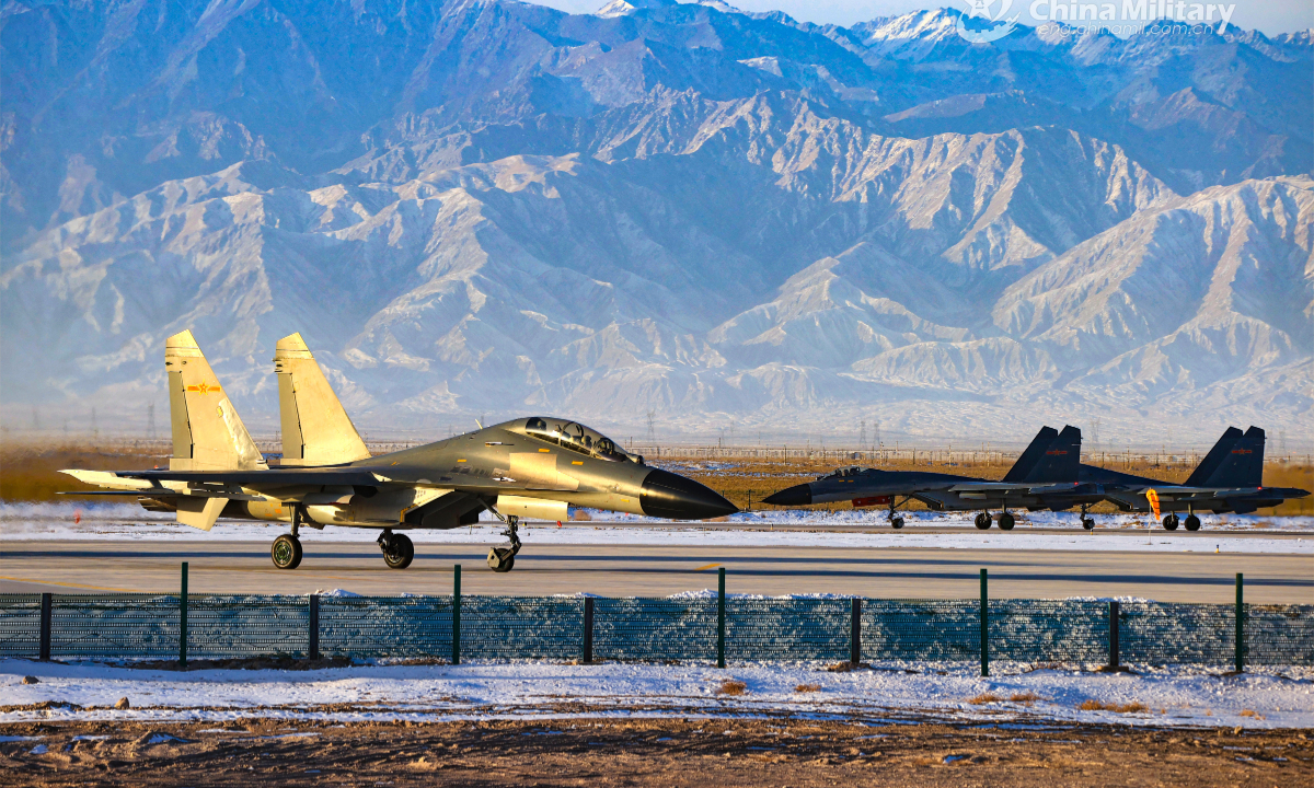 Fighter jets attached to an aviation brigade of the Air Force taxi on the runway before takeoff for a high-intensity flight training exercise in early February, 2023. Photo: China Military