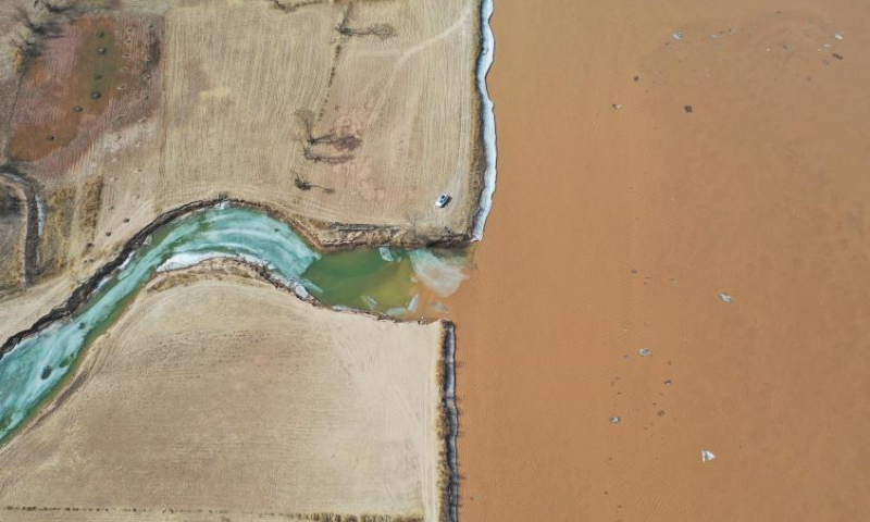 This aerial photo taken on March 11, 2023 shows the scenery along a section of the Yellow River in Togtoh County of Hohhot, north China's Inner Mongolia Autonomous Region. (Xinhua/Liu Lei)