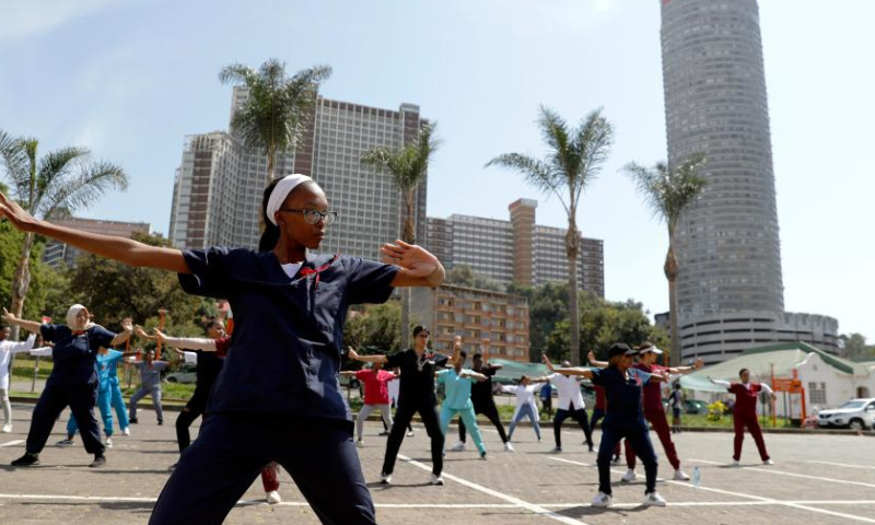 Students practice Baduanjin (literally meaning eight steps to healthy living) at the University of Johannesburg in Johannesburg, South Africa, March 17, 2023. The university held a Chinese medicine promotion event on Friday. (Xinhua/Zhang Yudong)