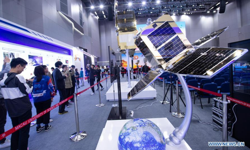 Visitors view exhibits at an aerospace exhibition marking the 20th anniversary of Macao's return to the motherland at Macao University of Science and Technolocy in Macao, South China, December 15, 2019. Photo: Xinhua