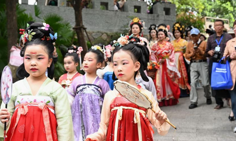 People in festival attire celebrate Hua Zhao Jie, meaning Flower Festival, at a park in Fuzhou, southeast China's Fujian Province, March 11, 2023. (Xinhua/Lin Shanchuan)