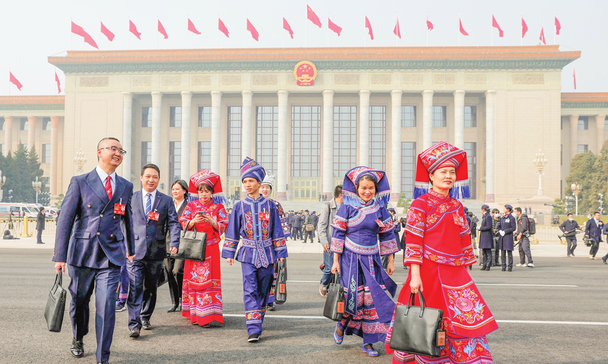 Delegates of ethnic groups leave the Great Hall of the People following the opening meeting of the first session of the 14th the National People's Congress in Beijing on March 5, 2023. Photo: IC