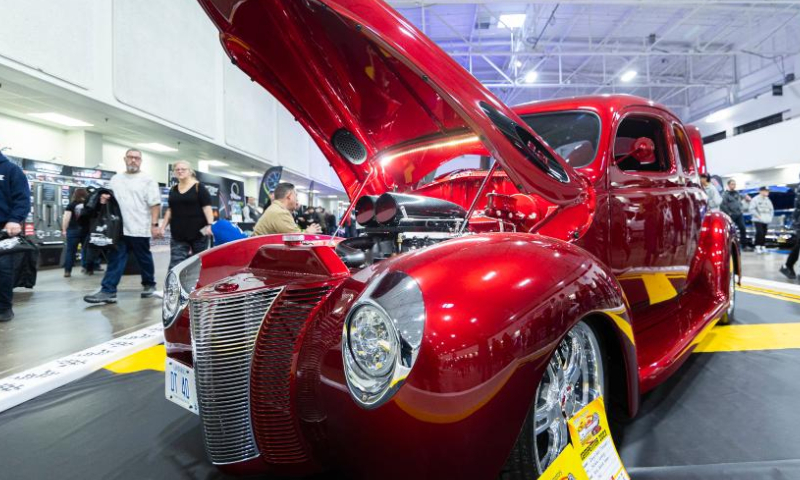 People look at a custom vehicle during the 2023 Toronto Motorama Custom Car & Motorsports Expo in Mississauga, the Greater Toronto Area, Canada, on March 10, 2023. Featuring hundreds of custom vehicles of all sorts, this annual three-day event kicked off here on Friday. (Photo by Zou Zheng/Xinhua)