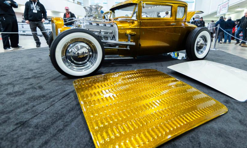 People look at a custom vehicle during the 2023 Toronto Motorama Custom Car & Motorsports Expo in Mississauga, the Greater Toronto Area, Canada, on March 10, 2023. Featuring hundreds of custom vehicles of all sorts, this annual three-day event kicked off here on Friday. (Photo by Zou Zheng/Xinhua)