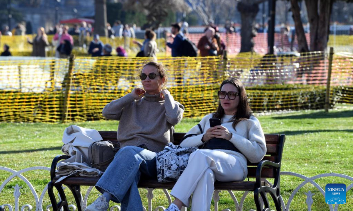 People take a rest near the Hagia Sophia in Istanbul, Turkey, March 15, 2023. Photo:Xinhua